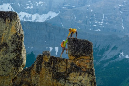 Two mountaineers rock climbing