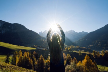 Woman reaches for the sun