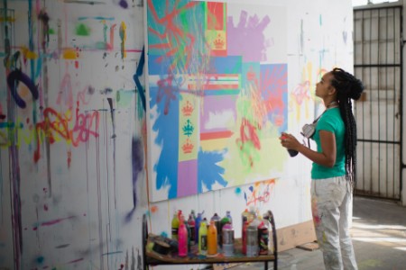 Young female artist working in her studio