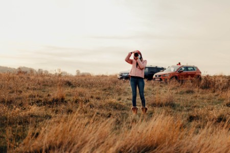 woman photographing on field