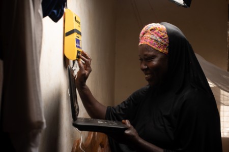 Woman easy solar device Sierra Leone