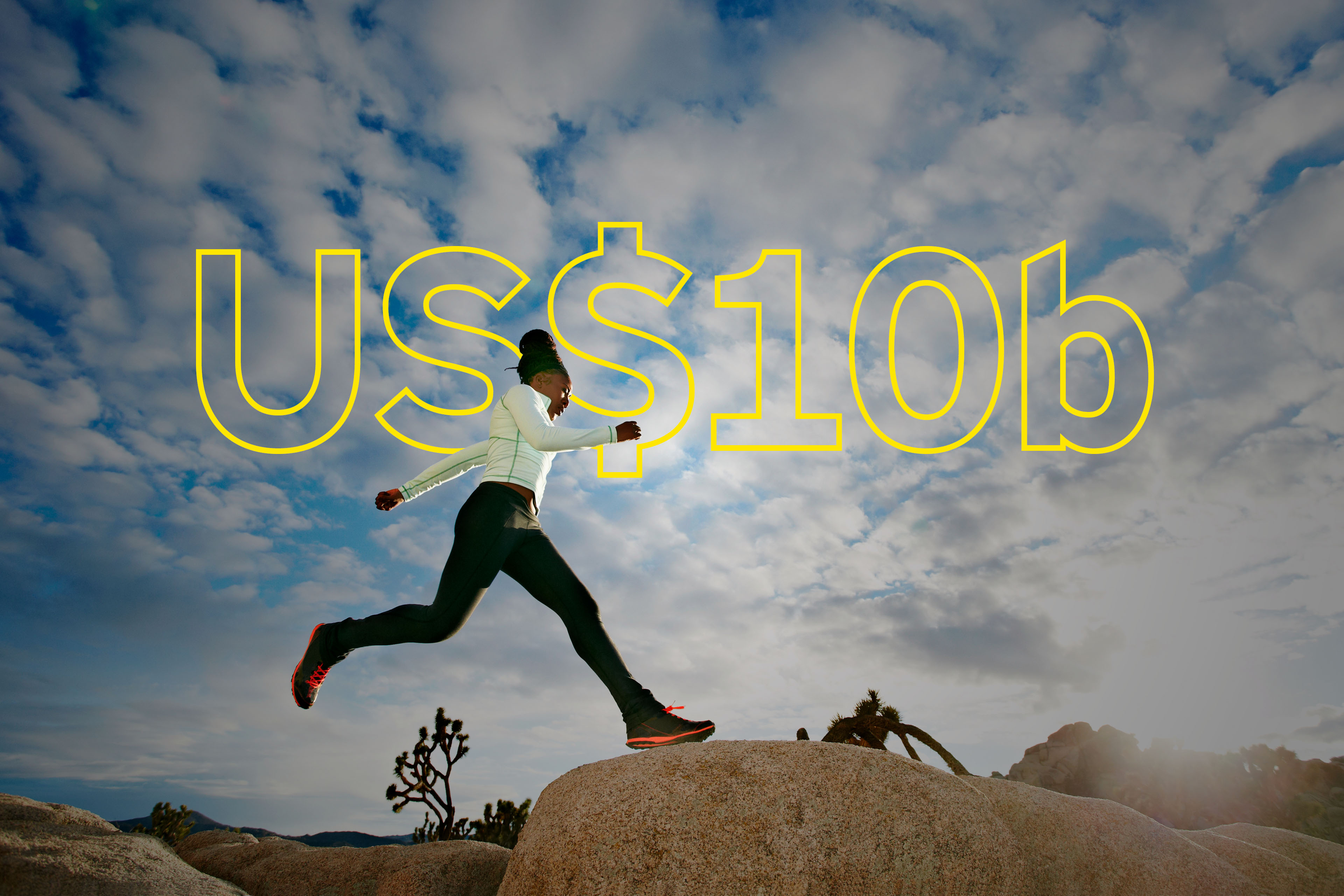 Black runner in desert landscape, Joshua Tree National Park, USA - overlaid is yellow text saying US$10b