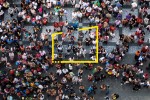 Aerial photograph of people gathered in a square metadata image
