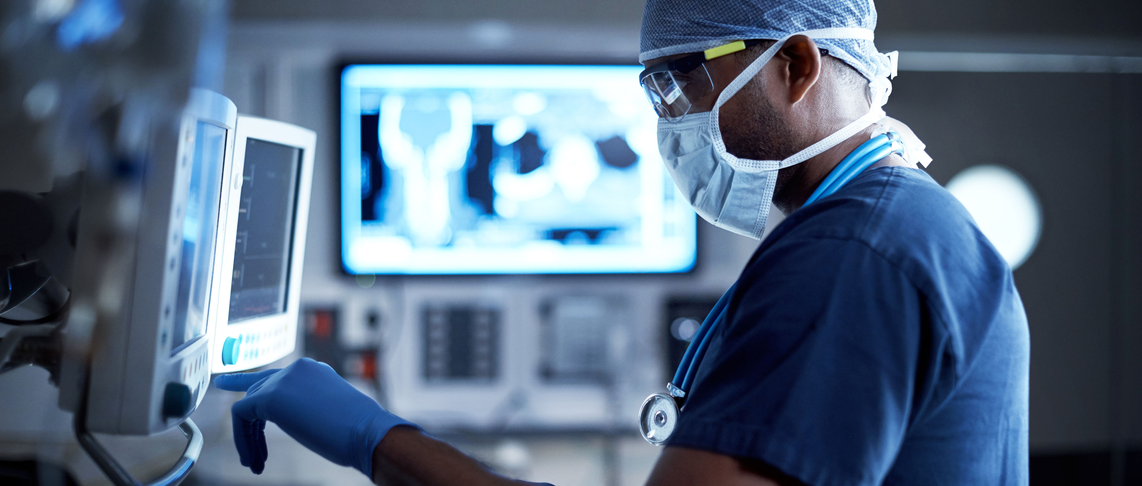 Surgeon looking at a monitor in an operating room
