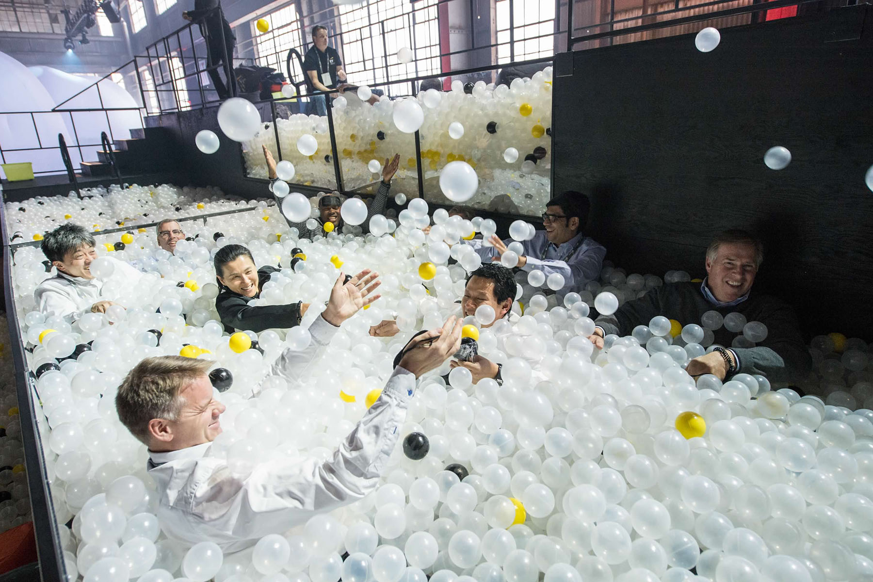 Innovation realized attendees in a ball pool