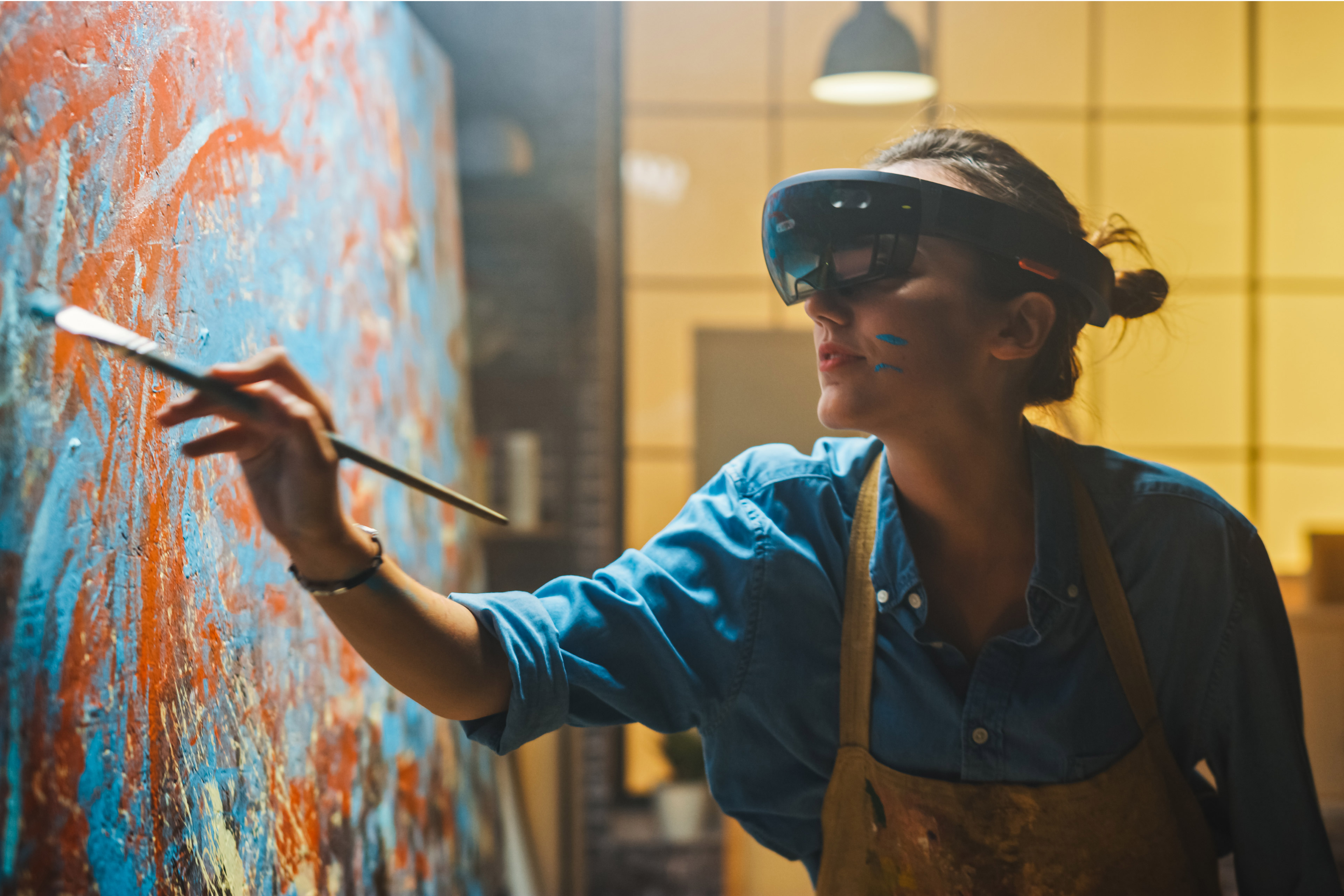 women wearing ar headset painting on wall