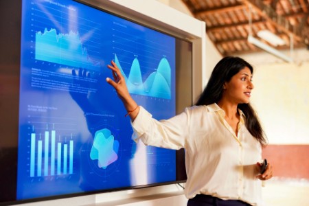 Businesswoman sharing charts in a presentation speech