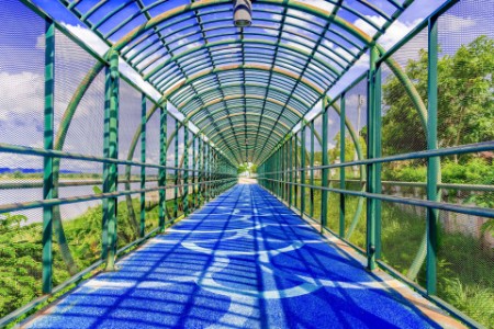 Circular footbridge with blue path