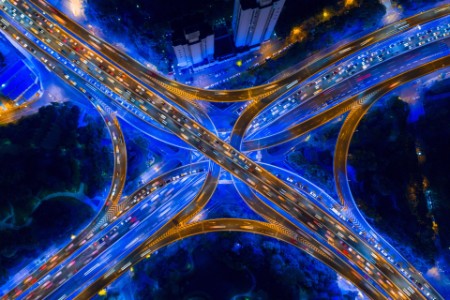 High angle of busy road junction at night