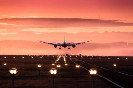 Sunset aeroplane taking off