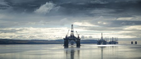 Oil rigs float off the coast of invergordon scotland