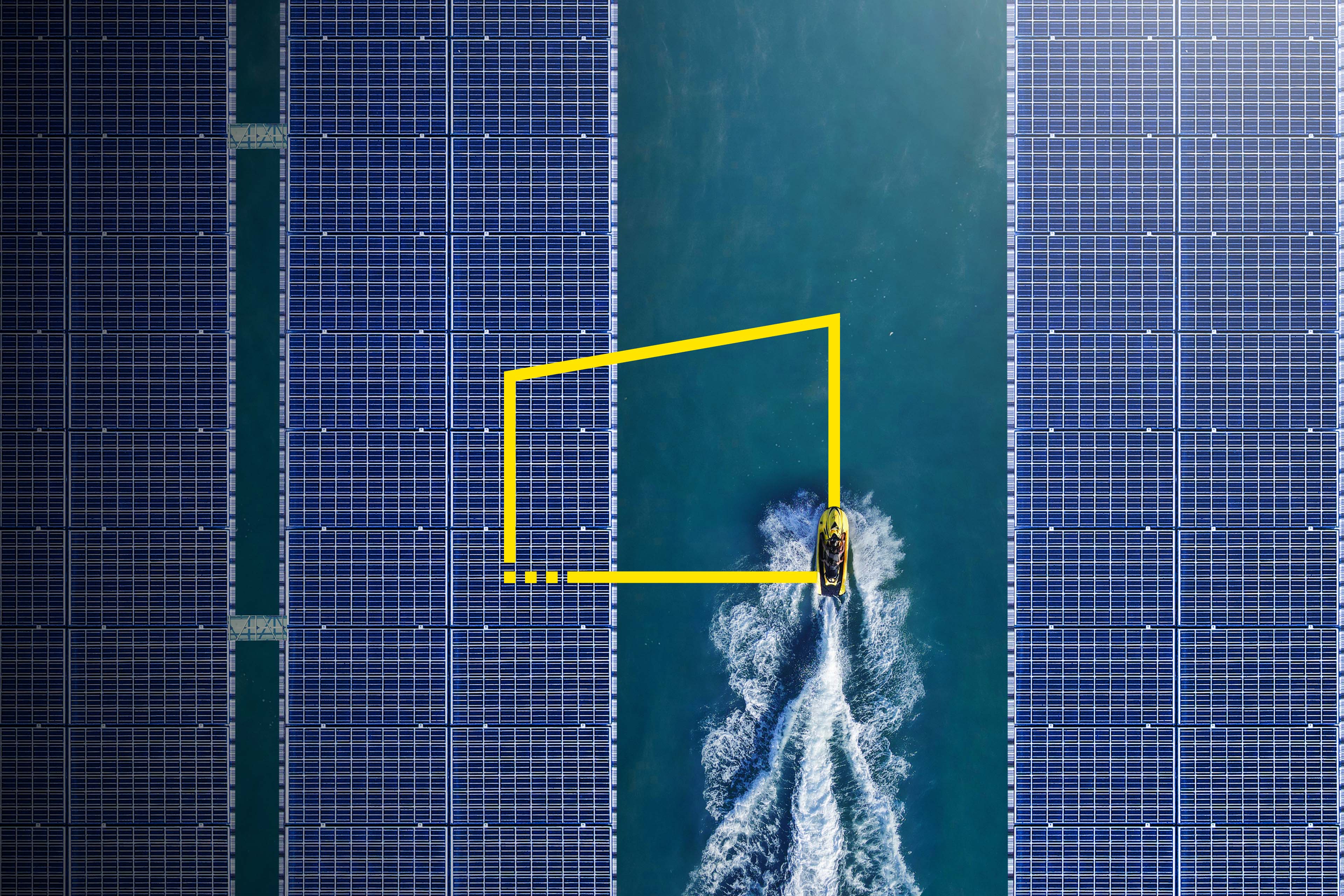 Aerial view of Jetski between solar panels floating