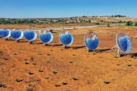 Solar thermal power station with parabolic dish reflectors in outback australia