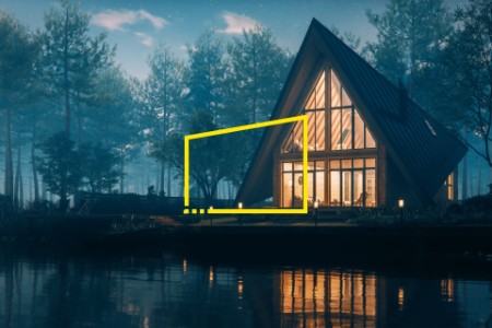 triangular modern lake house in misty forest