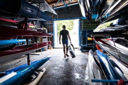 young man kayak canoe storage room