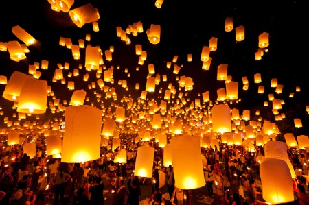 crowd people releasing chinese lanterns night