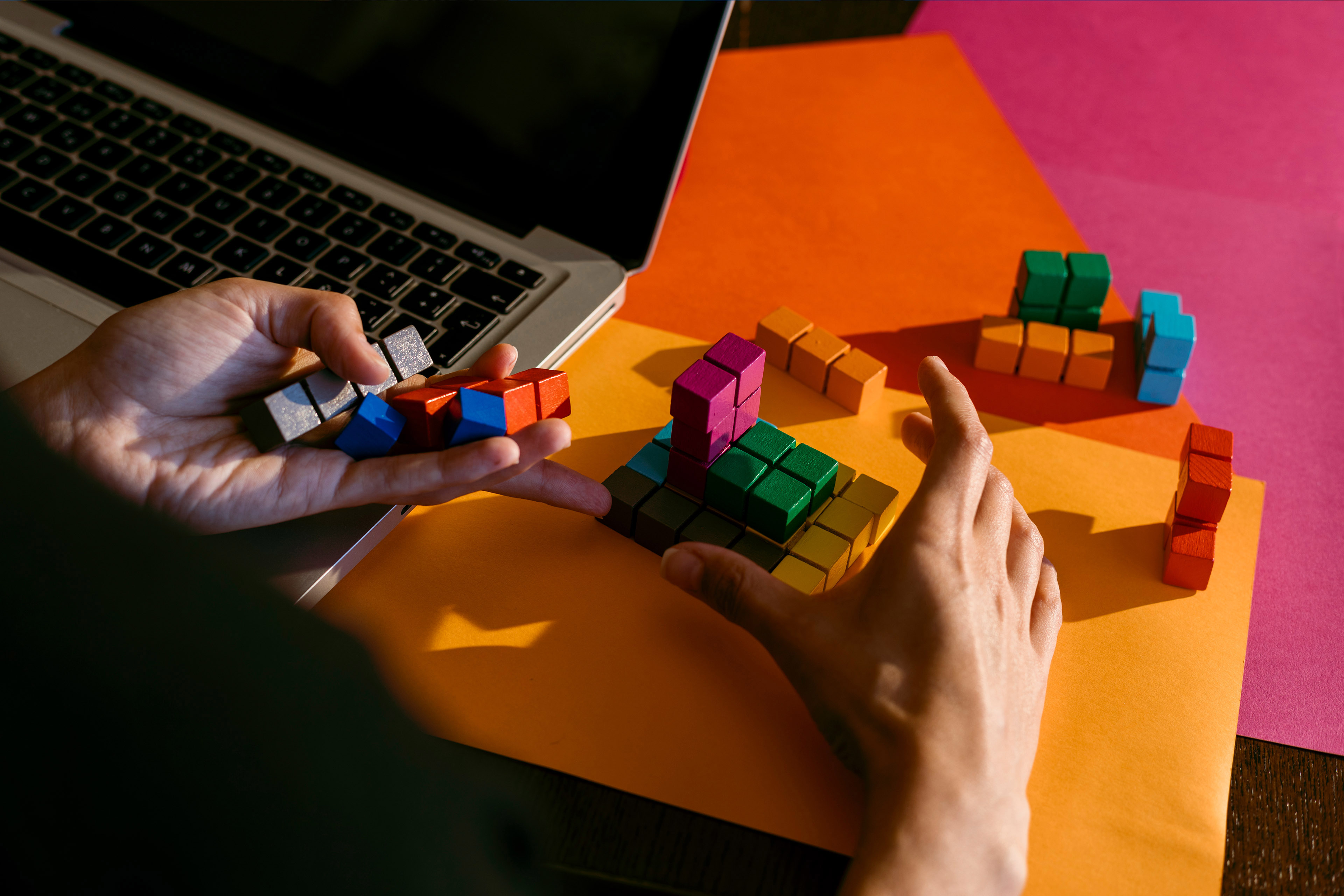 https://assets.ey.com/content/dam/ey-sites/ey-com/en_gl/topics/strategy/hero-images/ey-hands-of-businesswoman-playing-with-colorful-toy-blocks.jpg