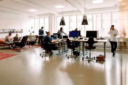 Male and female entrepreneurs working in creative office
