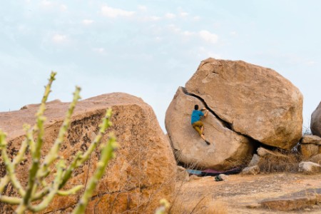 man boulderer in karnataka india background