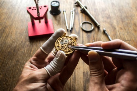 Close up of a watchmaker at work