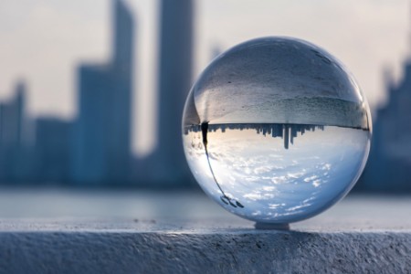 Reflection of city in a glass ball