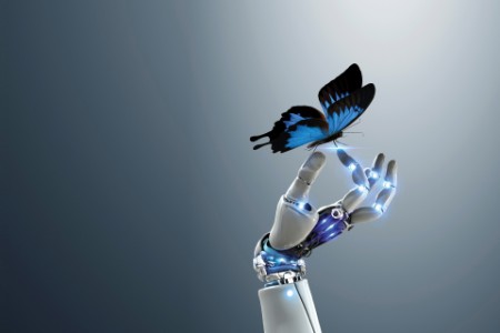 Robotic hand holding butterfly