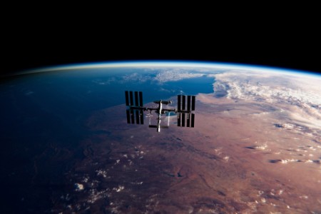 International Space Station (ISS) Orbiting Earth in Space - SpaceX & NASA Research - ISS Satellite Sunset View Low Orbit
