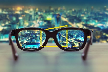 Night cityscape focused in glasses lenses