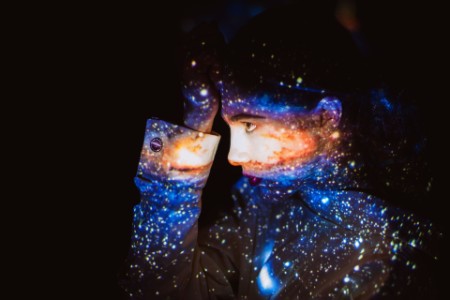  Woman with the Galaxy Projected on to Her