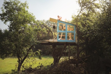 father on tree building tree house for kids