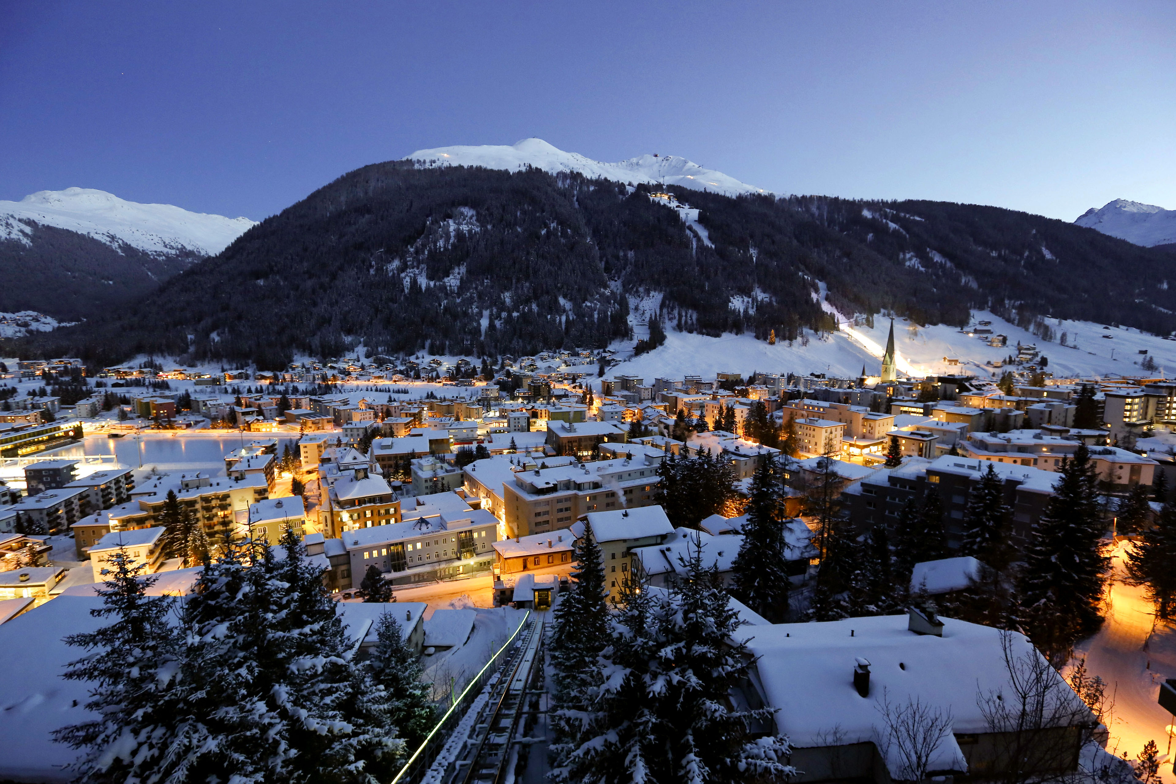 Snow covered buildings dusk town Davos Switzerland