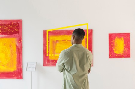 man paintings modern art gallery