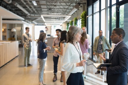 Business people networking in office lobby