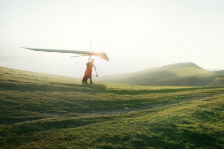 Hang glider setting off from hill top