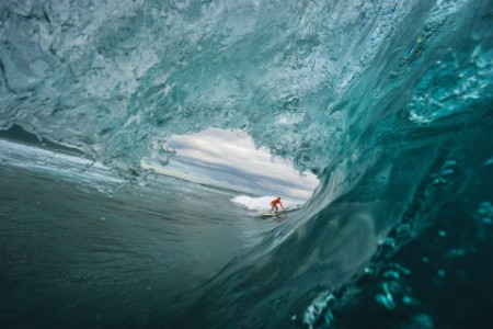 female surfer riding a wave