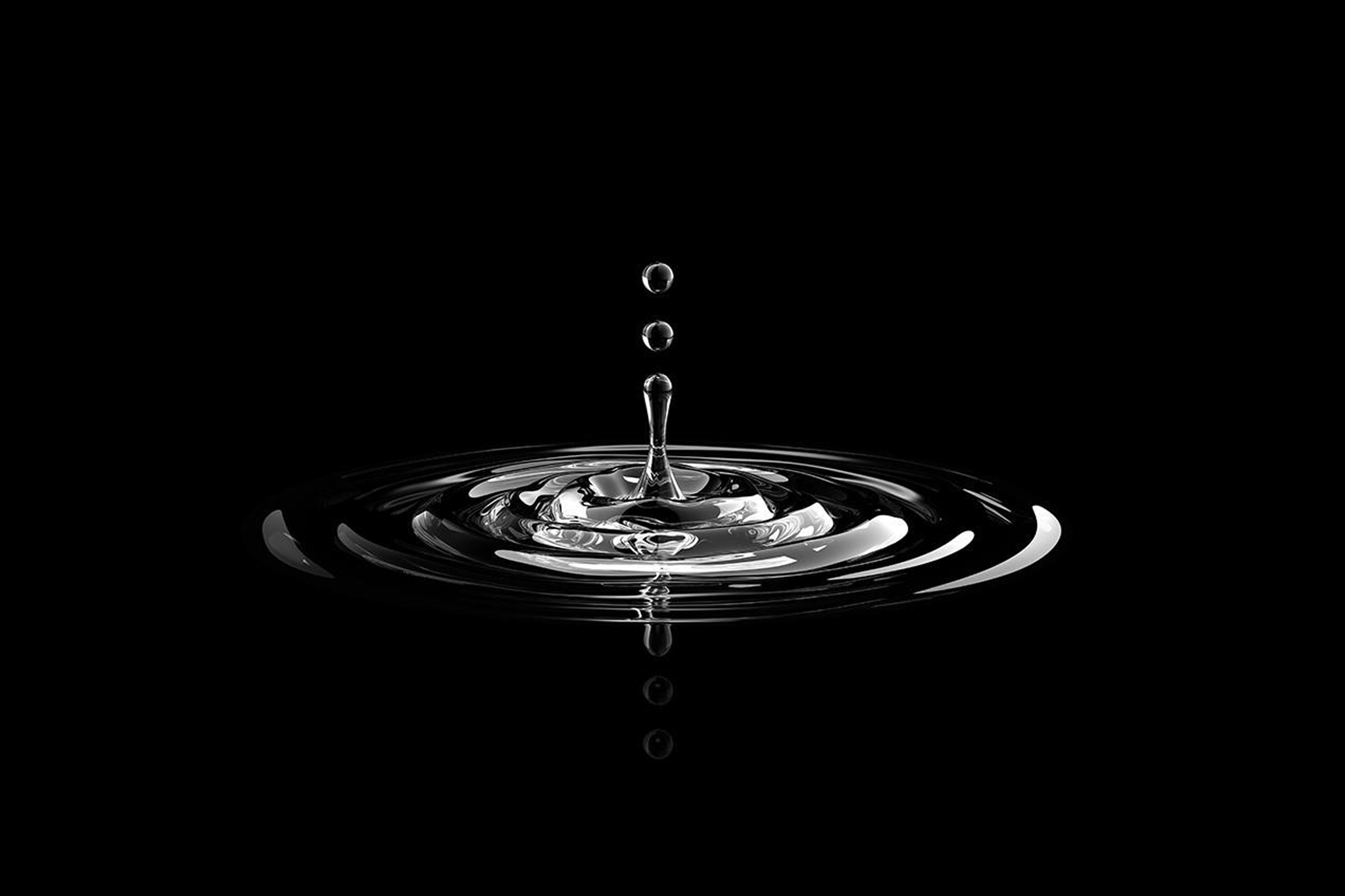 Water drop creating ripples around it 