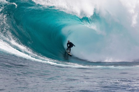 Man surfing a wave in ocean