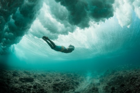 Diver diving in ocean
