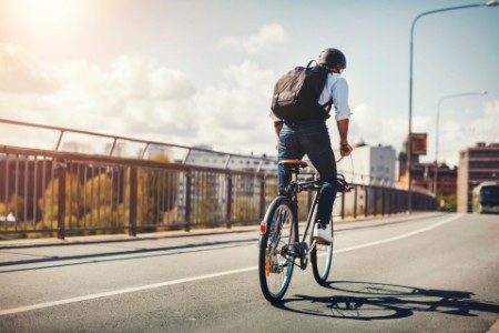 EY Luxembourg Sustainability report banner with a man on bicycle