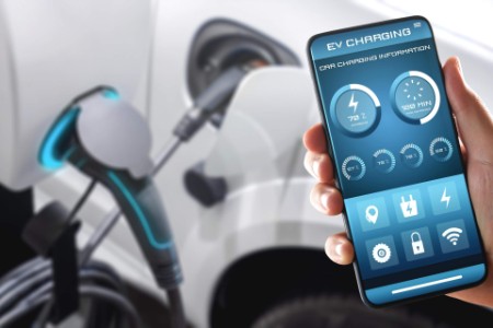 EV charging station for electric car with mobile app displaying charger status