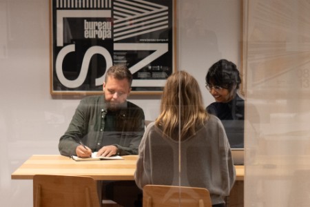 Photo of Man sitting and writing during a workshop.