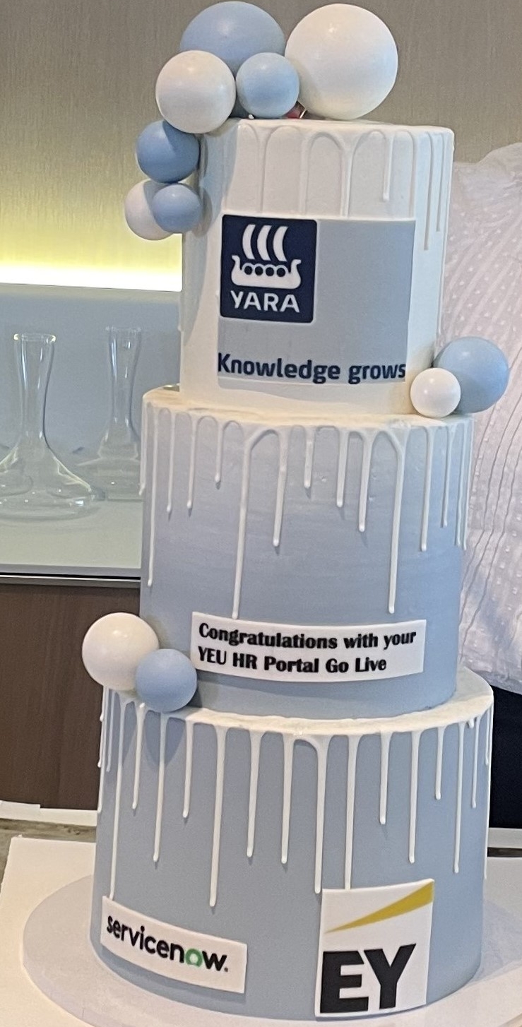 EY, Yara and ServiceNow branded cake