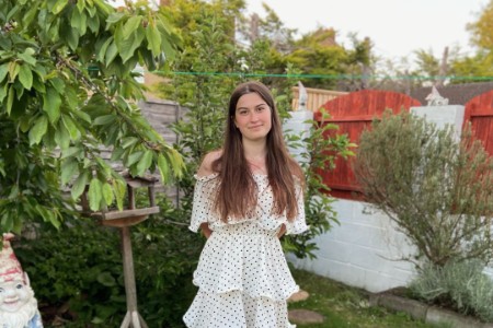 A photo of Amber outside in a garden