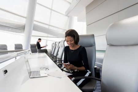 business-woman-sitting-in-a-board-room