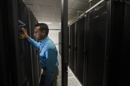 Indian businessman working in server room