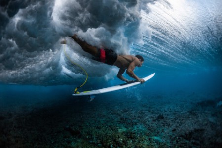 EY surfer under water