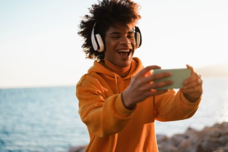 Happy african millennial listening music playlist