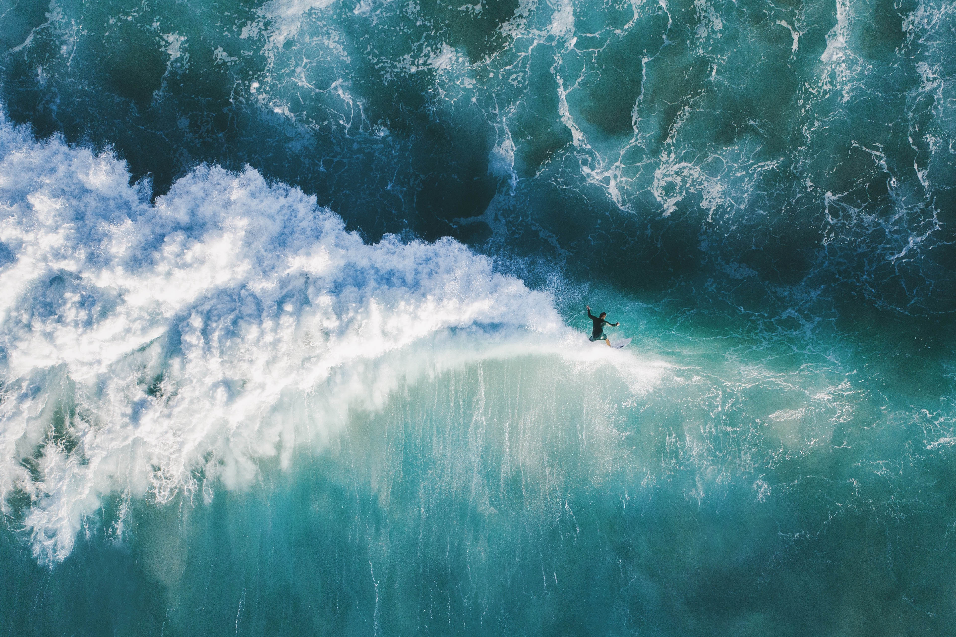 High Angle View Of Man Surfing In Sea