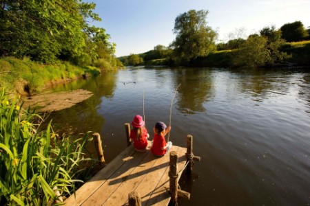 Photo of kids fishing in a lake
