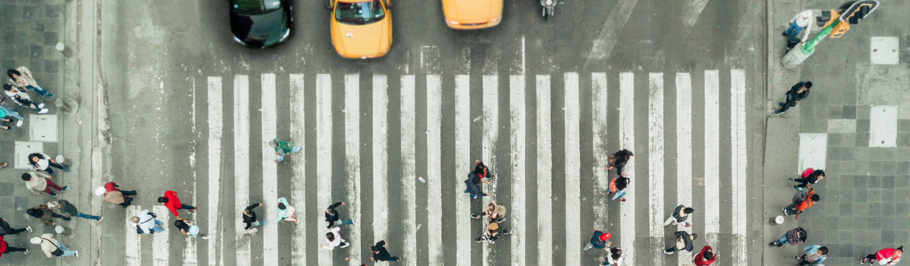 Aerial view of pedestrians on zebra crossing